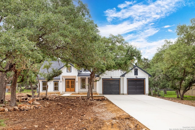 modern inspired farmhouse featuring a garage