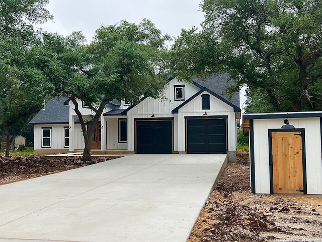 modern inspired farmhouse featuring a garage