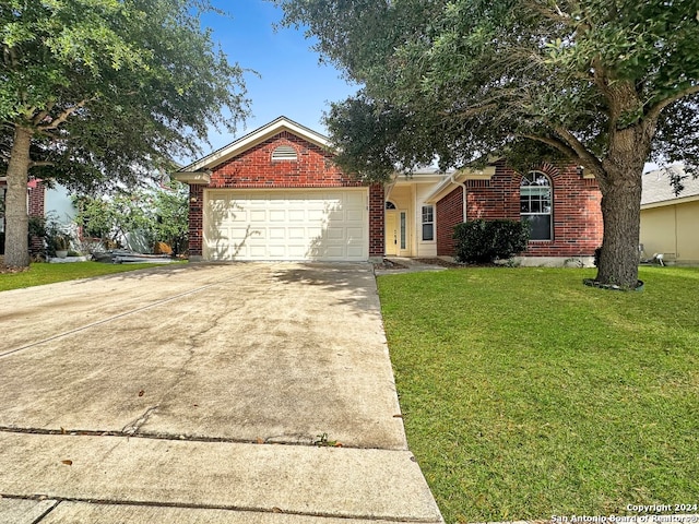 single story home with a front yard and a garage