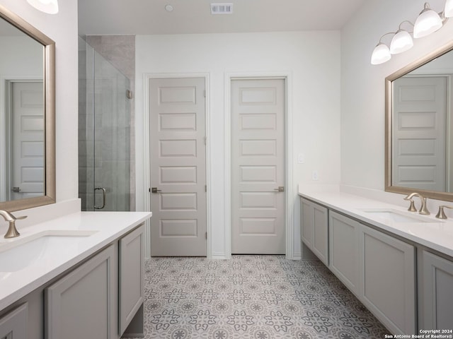 bathroom with tile flooring and vanity