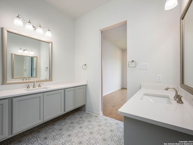 bathroom featuring tile floors and vanity