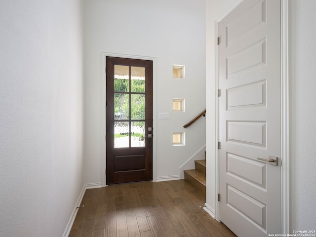 foyer with dark hardwood / wood-style floors