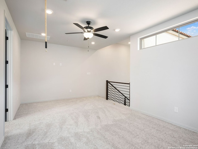 basement with carpet and ceiling fan