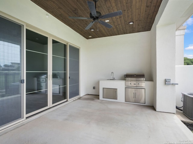 view of patio / terrace with exterior kitchen, a grill, ceiling fan, and central AC unit