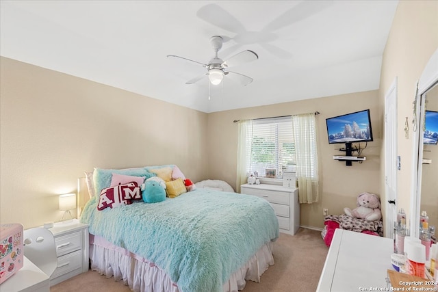 bedroom with ceiling fan and light carpet