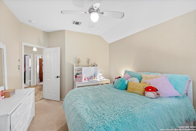 carpeted bedroom featuring ceiling fan and vaulted ceiling