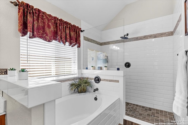 bathroom with independent shower and bath and vaulted ceiling