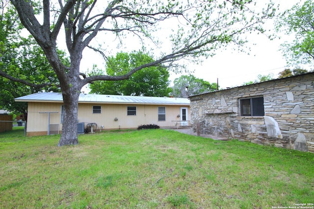 back of house with a yard