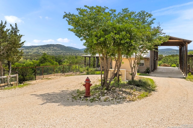 exterior space with a mountain view and a carport