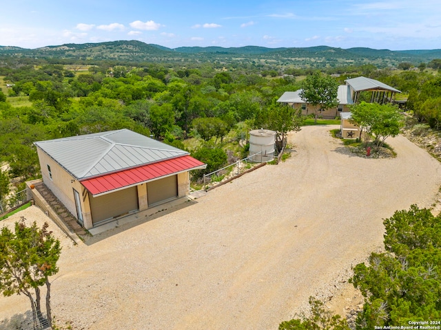 birds eye view of property with a mountain view