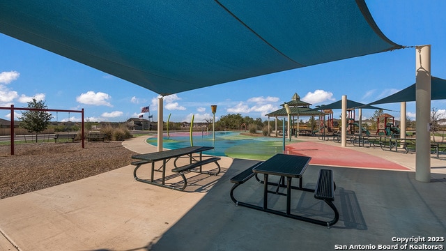 view of property's community with a playground