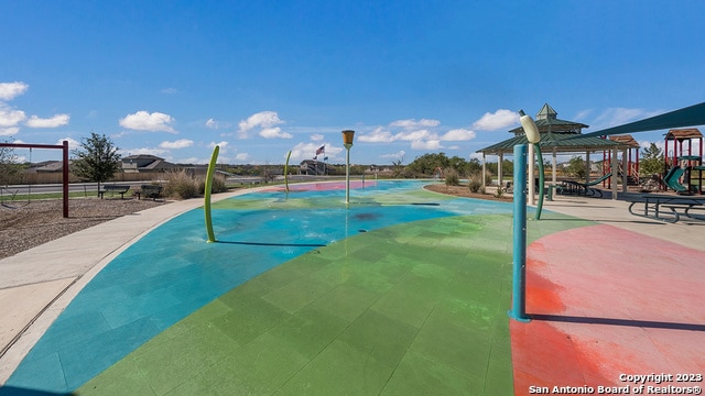 view of pool with a gazebo and a playground