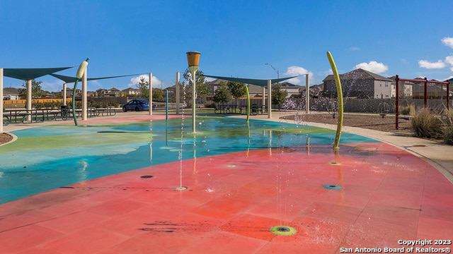 view of pool featuring a playground