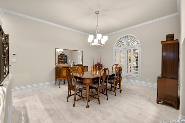 dining space with a notable chandelier and crown molding