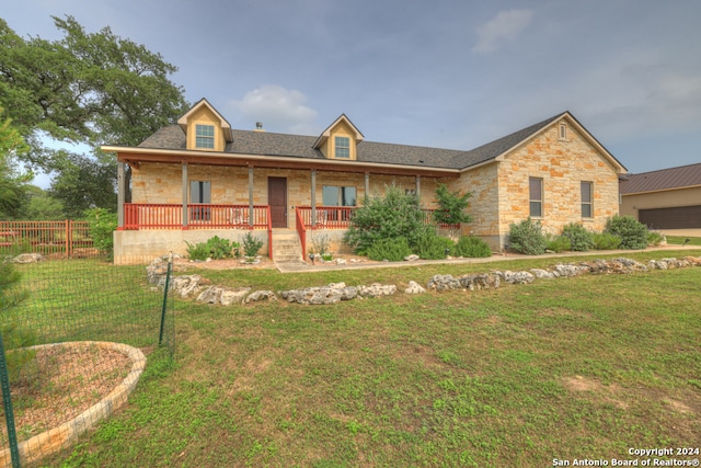 view of front of property with a front lawn and a porch