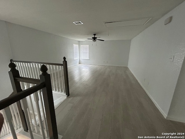 hall with hardwood / wood-style flooring