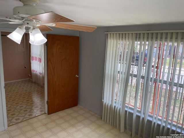 unfurnished room featuring ceiling fan