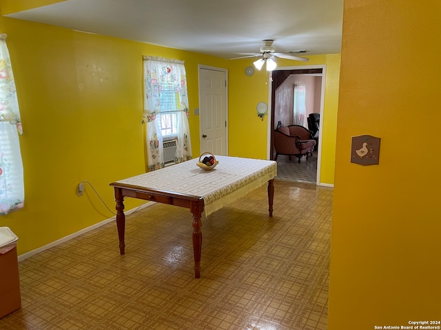 dining area with tile floors and ceiling fan