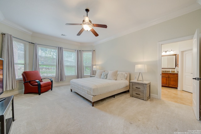 bedroom featuring light tile flooring, ceiling fan, crown molding, and ensuite bath