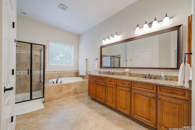 bathroom featuring dual bowl vanity, independent shower and bath, and tile floors