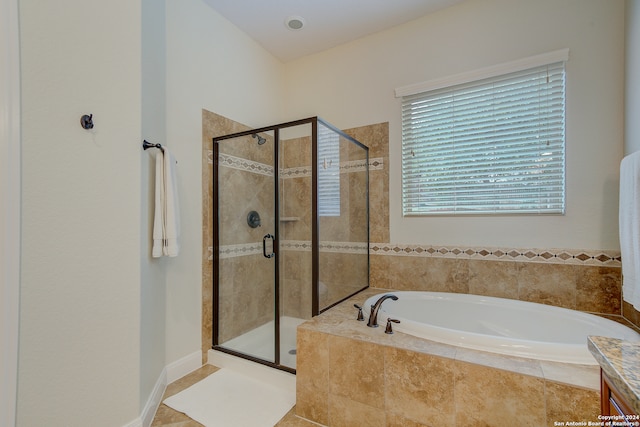 bathroom with tile floors and plus walk in shower