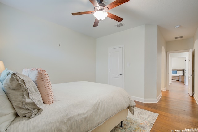 bedroom featuring ceiling fan and light hardwood / wood-style flooring