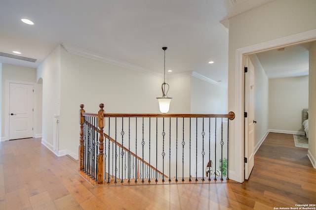 hall featuring crown molding and wood-type flooring