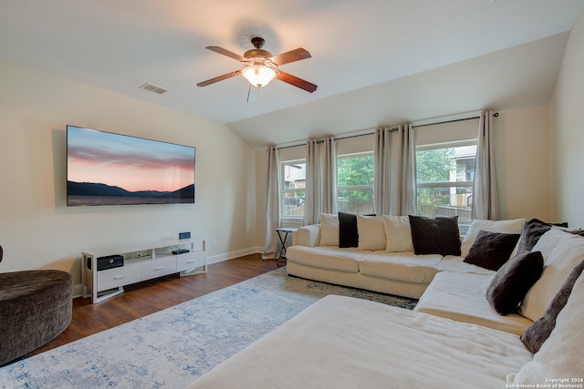 living room featuring lofted ceiling, dark hardwood / wood-style floors, and ceiling fan