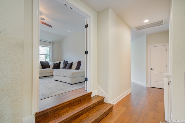 hall with wood-type flooring