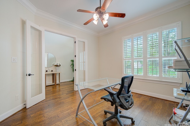 office space with plenty of natural light, ornamental molding, and dark wood-type flooring