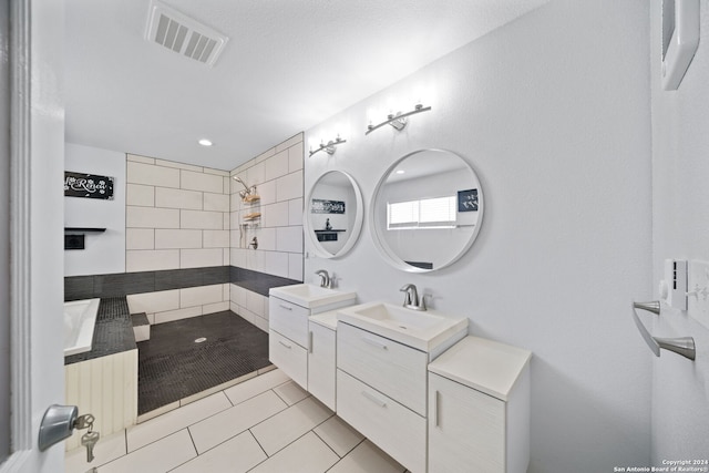 bathroom with dual vanity and tile flooring