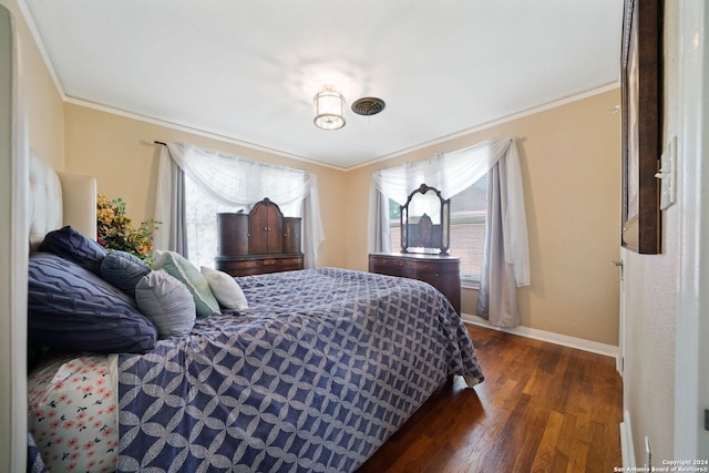 bedroom featuring dark hardwood / wood-style flooring and ornamental molding