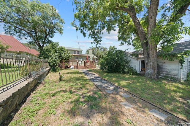 view of yard featuring a wooden deck