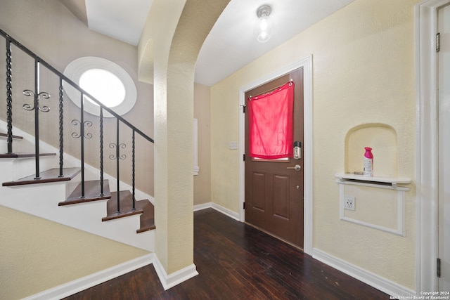 foyer with dark hardwood / wood-style flooring