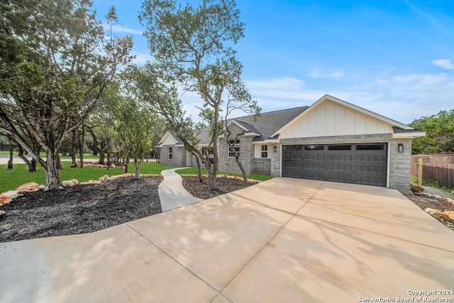 view of front facade with a garage and a front yard