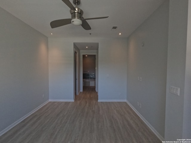 unfurnished room featuring hardwood / wood-style flooring and ceiling fan