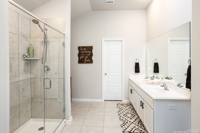 bathroom featuring vaulted ceiling, dual sinks, tile floors, an enclosed shower, and large vanity