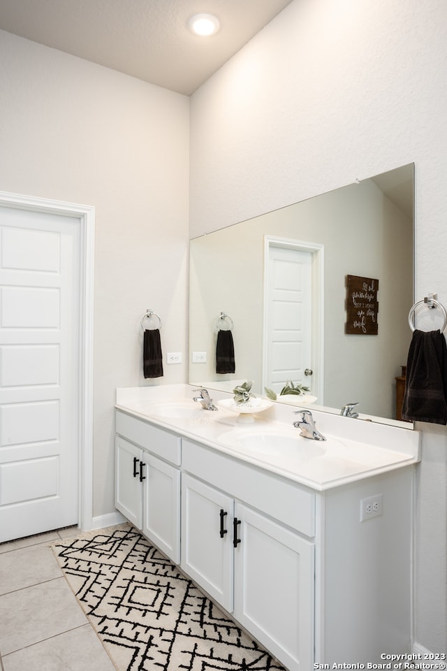 bathroom featuring tile flooring and vanity