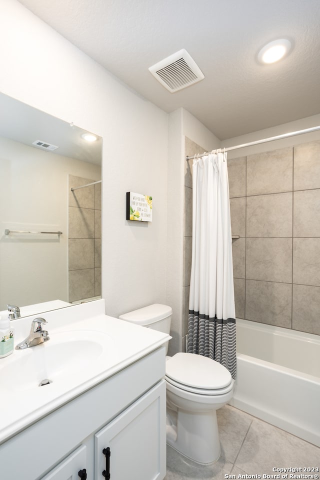 full bathroom featuring shower / bathtub combination with curtain, tile flooring, vanity, and toilet