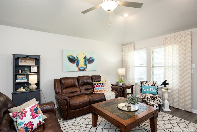 living room with ceiling fan and light hardwood / wood-style floors