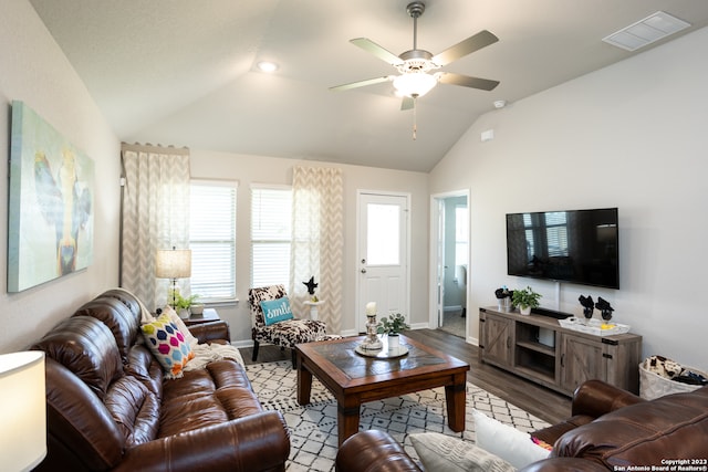 living room featuring vaulted ceiling, hardwood / wood-style floors, and ceiling fan