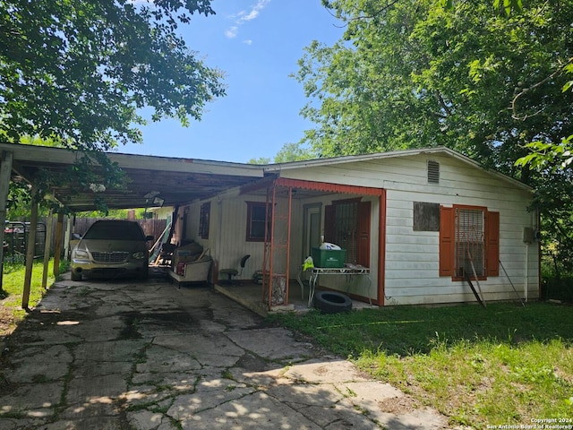 view of front of home with a carport