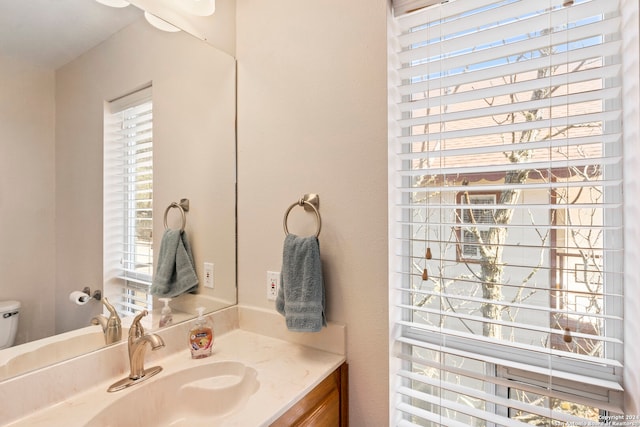 bathroom with vanity and toilet