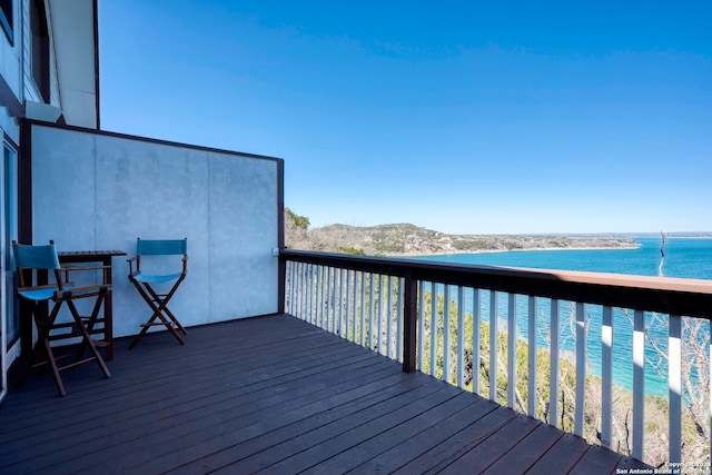 wooden deck featuring a water view