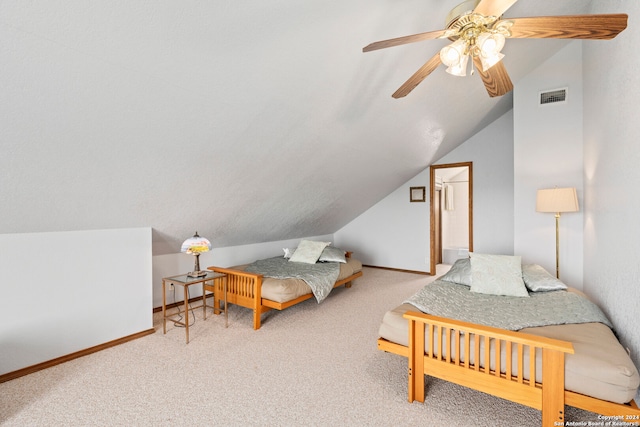 bedroom with carpet, ceiling fan, and vaulted ceiling