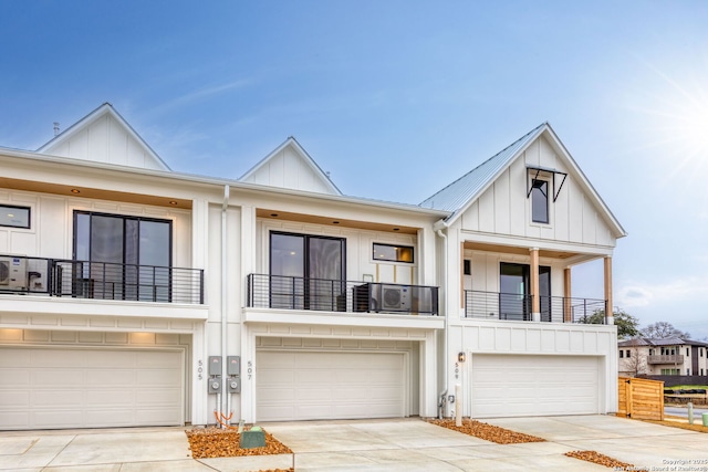 view of front of property featuring a garage and a balcony