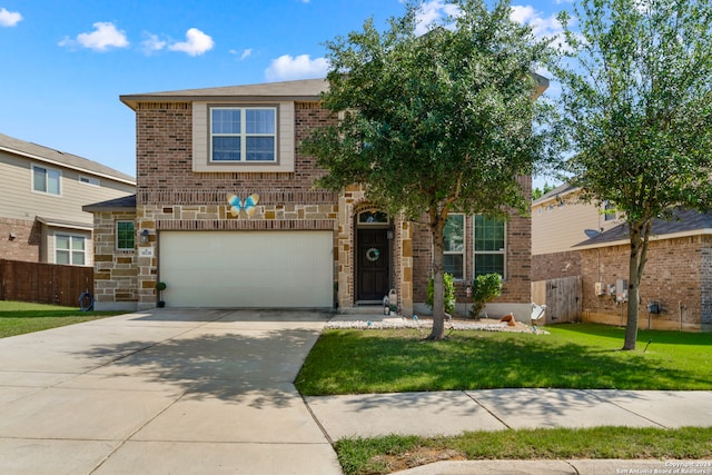 view of front of property with a garage and a front yard