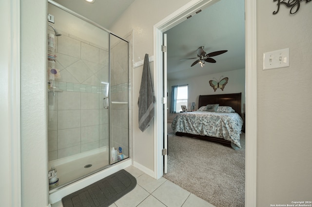 bathroom featuring tile floors, ceiling fan, and a shower with shower door