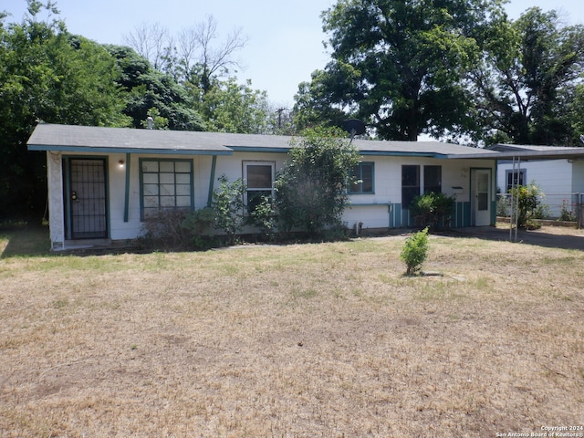 ranch-style house with a front yard