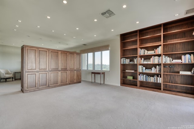 interior space with recessed lighting, light colored carpet, and visible vents